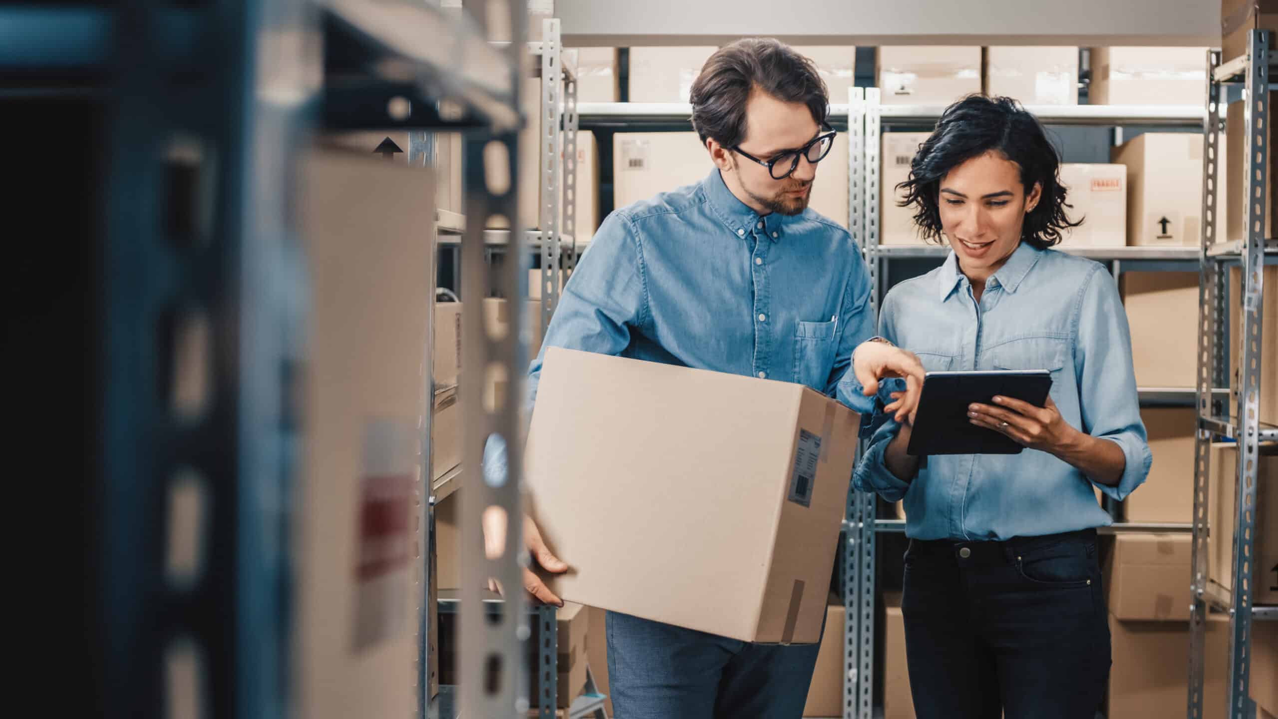 Two manufacturing professionals in a warehouse